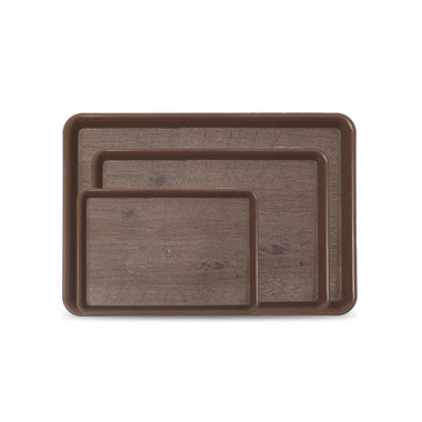Set of three brown serving trays of different sizes on a white background